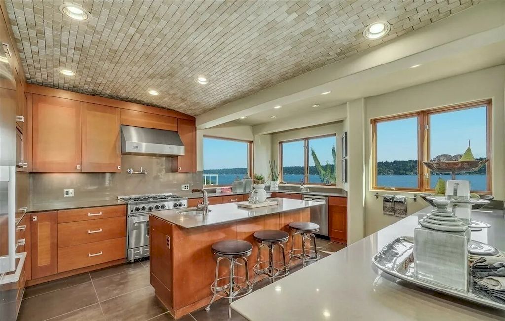 The Stunning Mediterranean Waterfront Villa in Washington features incredible views of lake now available for sale. This home is located at 7920 1/2 Seward Park Ave S, Seattle, Washington