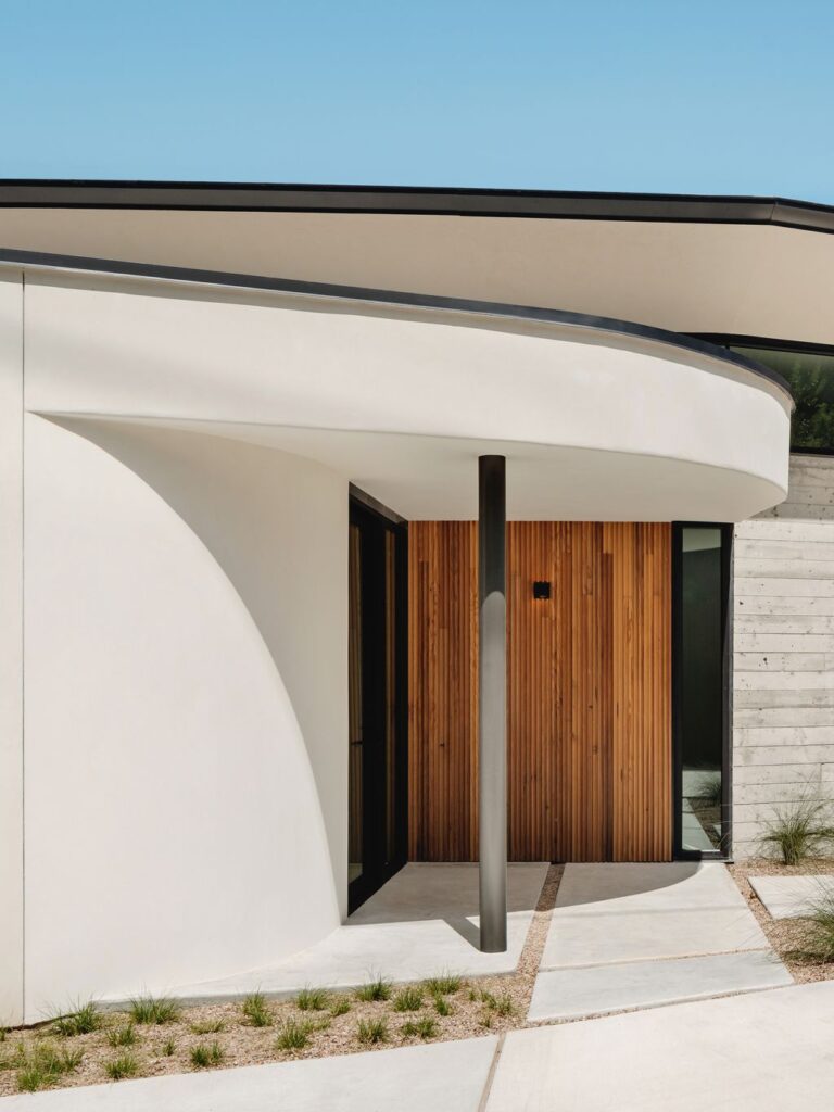 The High Road, impressive boomerang shape house by Ravel Architecture