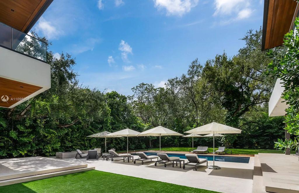 This-13900000-Miami-Home-nested-within-Mature-Oaks-and-Lush-Landscaping-11