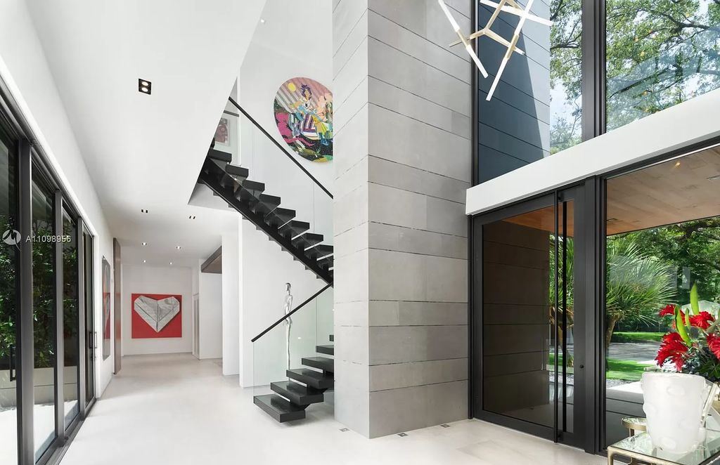 The Miami Home is a tropical modern estate extends natural light throughout offers the utmost privacy now available for sale. This home located at 5400 Hammock Dr, Miami, Florida