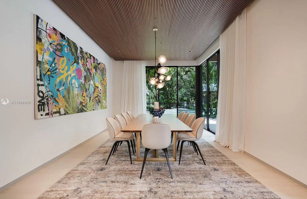 The Miami Home is a tropical modern estate extends natural light throughout offers the utmost privacy now available for sale. This home located at 5400 Hammock Dr, Miami, Florida