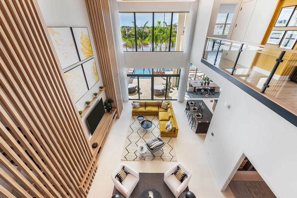 The Boca Raton Home offers a contemporary Geometric Pool with Negative Edge spa and gorgeous upgraded polished Travertine deck overlooking the lake now available for sale. This home located at 17161 Ludovica Ln, Boca Raton, Florida