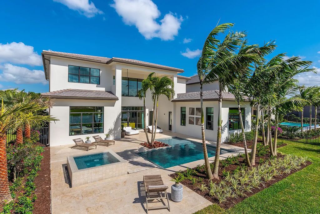 The Boca Raton Home offers a contemporary Geometric Pool with Negative Edge spa and gorgeous upgraded polished Travertine deck overlooking the lake now available for sale. This home located at 17161 Ludovica Ln, Boca Raton, Florida
