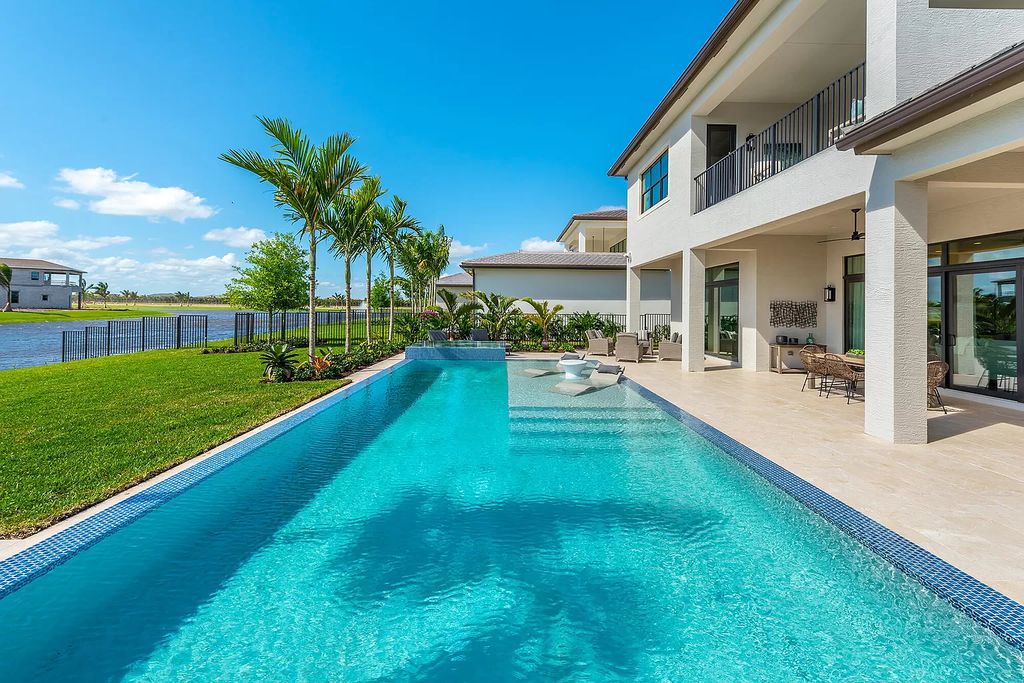 The Boca Raton Home with 2 story open great room concept floorplan and an amazing contemporary spill over pool now available for sale. This home located at 17167 Ludovica Ln, Boca Raton, Florida