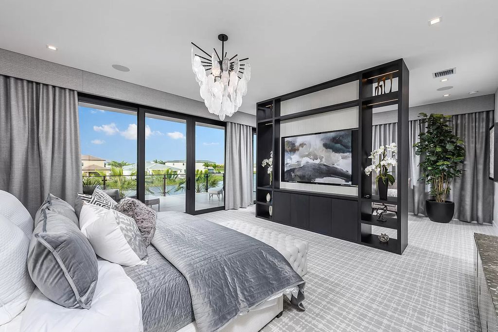 The Home in Boca Raton is a magnificent Modern estate featuring flat roof, floor to ceiling glass and extraordinary Ipey wood accents now available for sale. This home located at 17224 Brulee Breeze Way, Boca Raton, Florida