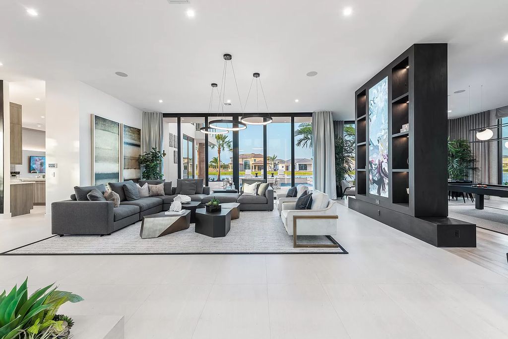 The Home in Boca Raton is a magnificent Modern estate featuring flat roof, floor to ceiling glass and extraordinary Ipey wood accents now available for sale. This home located at 17224 Brulee Breeze Way, Boca Raton, Florida