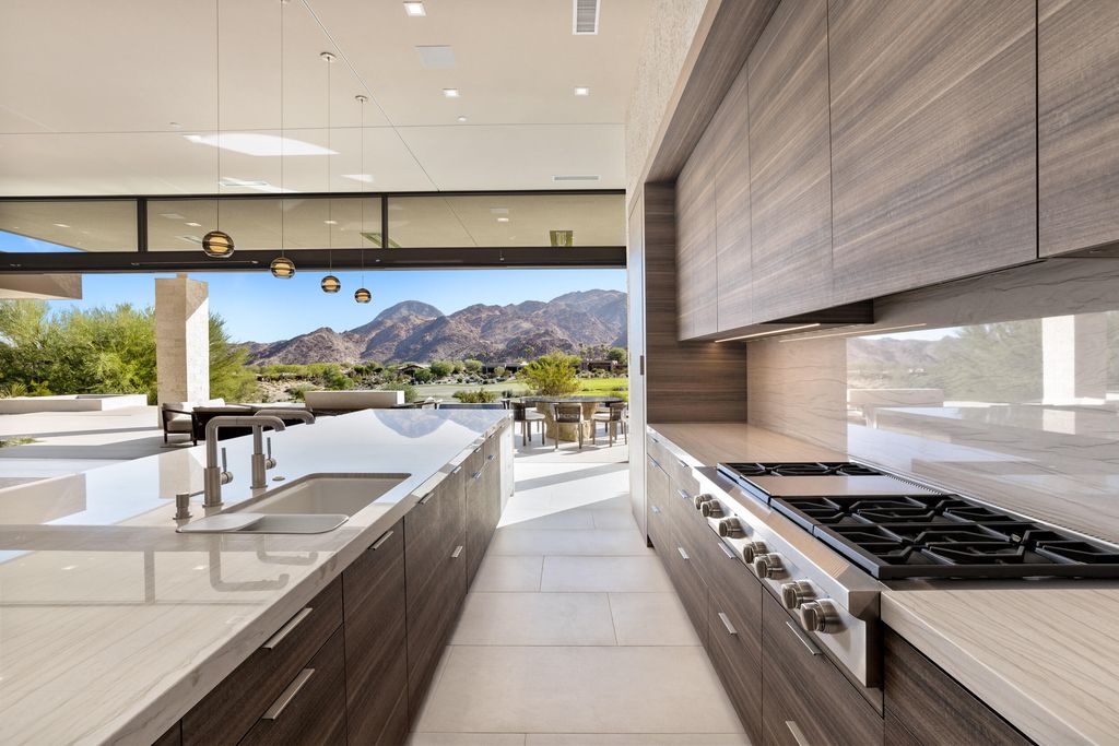 The Home in Indian Wells is a contemporary estate with architecturally stunning design and incredible mountain views now available for sale. This home located at 50806 Desert Arroyo Trl, Indian Wells, California