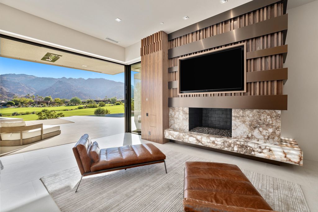 The Home in Indian Wells is a contemporary estate with architecturally stunning design and incredible mountain views now available for sale. This home located at 50806 Desert Arroyo Trl, Indian Wells, California