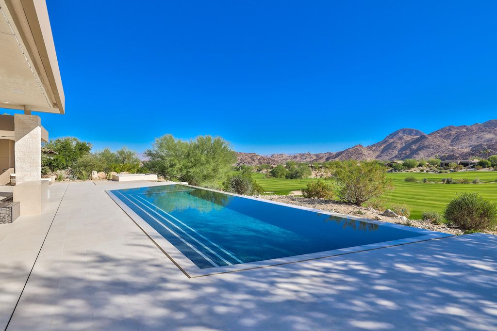 The Home in Indian Wells is a contemporary estate with architecturally stunning design and incredible mountain views now available for sale. This home located at 50806 Desert Arroyo Trl, Indian Wells, California