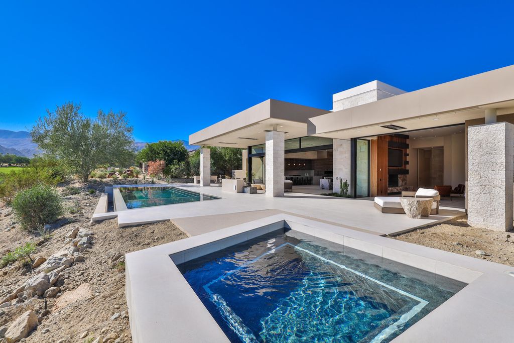 The Home in Indian Wells is a contemporary estate with architecturally stunning design and incredible mountain views now available for sale. This home located at 50806 Desert Arroyo Trl, Indian Wells, California