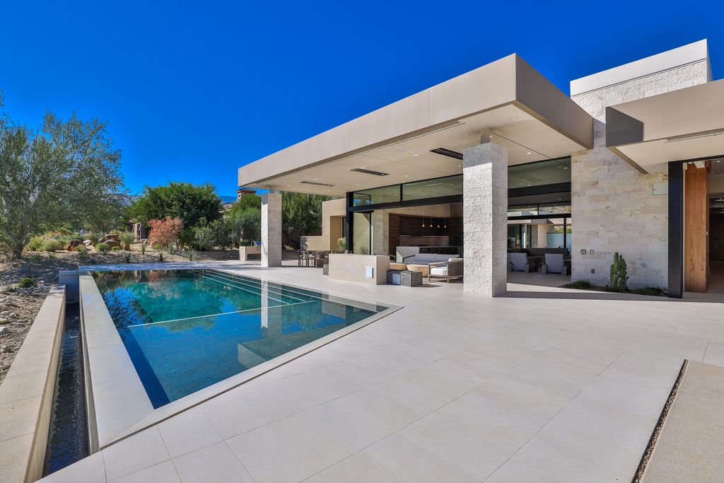 The Home in Indian Wells is a contemporary estate with architecturally stunning design and incredible mountain views now available for sale. This home located at 50806 Desert Arroyo Trl, Indian Wells, California