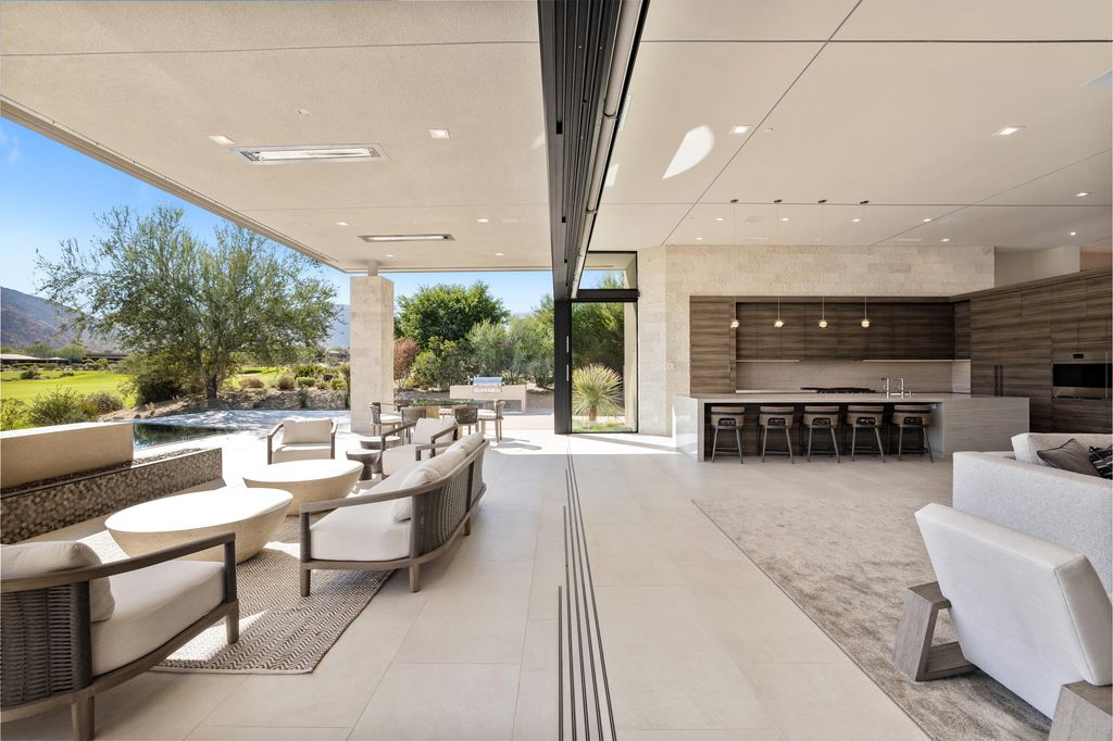 The Home in Indian Wells is a contemporary estate with architecturally stunning design and incredible mountain views now available for sale. This home located at 50806 Desert Arroyo Trl, Indian Wells, California