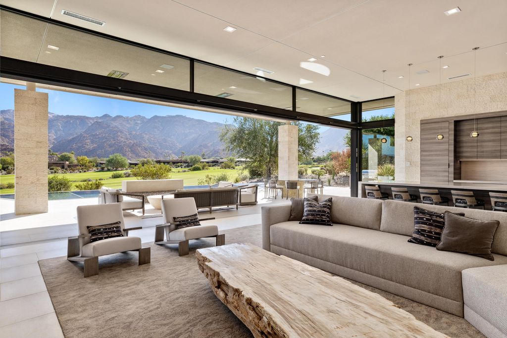 The Home in Indian Wells is a contemporary estate with architecturally stunning design and incredible mountain views now available for sale. This home located at 50806 Desert Arroyo Trl, Indian Wells, California