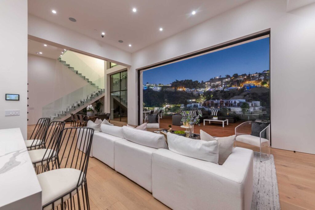 The Los Angeles Home is new construction contemporary masterpiece offers breathtaking views of the hills and city lights now available for sale. This home located at 1911 Sunset Plaza Dr, Los Angeles, California