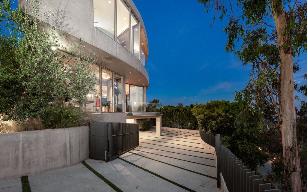 The Home in Los Angeles is an impeccably crafted three-story contemporary masterpiece with explosive, panoramic views now available for sale. This home located at 1227 N Tigertail Rd, Los Angeles, California