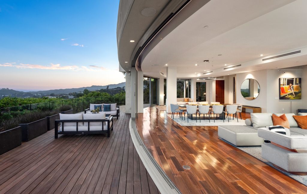 The Home in Los Angeles is an impeccably crafted three-story contemporary masterpiece with explosive, panoramic views now available for sale. This home located at 1227 N Tigertail Rd, Los Angeles, California