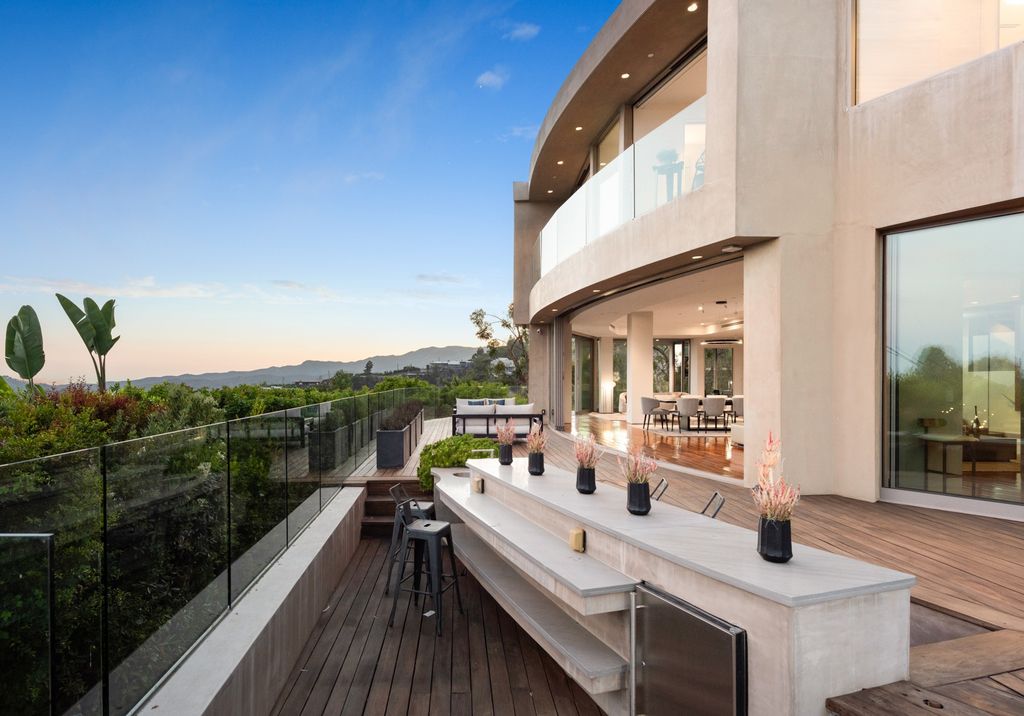 The Home in Los Angeles is an impeccably crafted three-story contemporary masterpiece with explosive, panoramic views now available for sale. This home located at 1227 N Tigertail Rd, Los Angeles, California