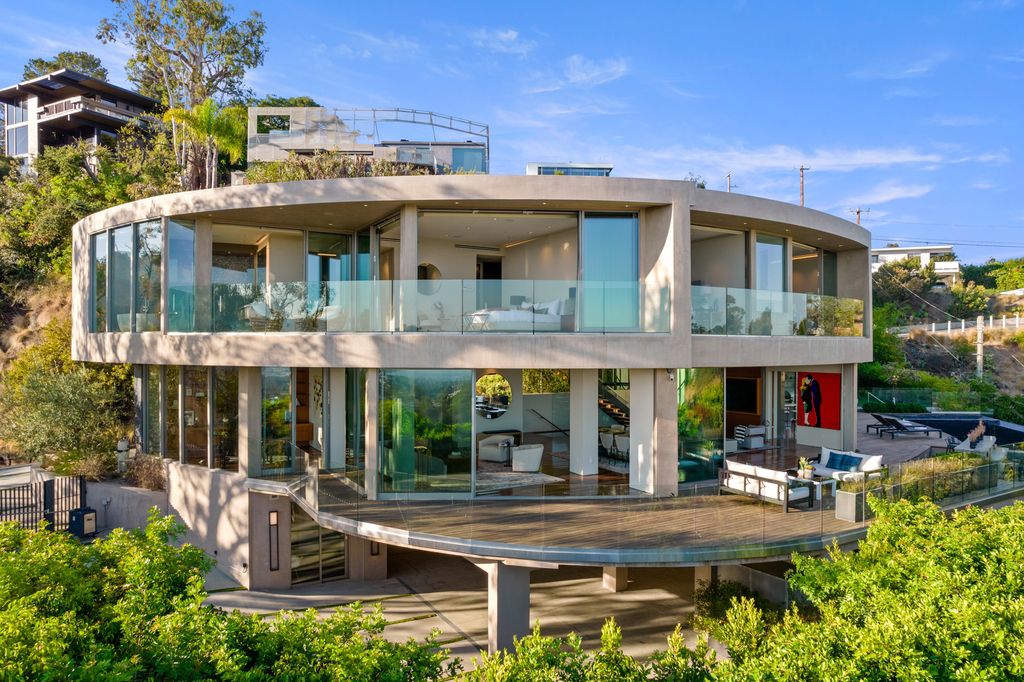 The Home in Los Angeles is an impeccably crafted three-story contemporary masterpiece with explosive, panoramic views now available for sale. This home located at 1227 N Tigertail Rd, Los Angeles, California