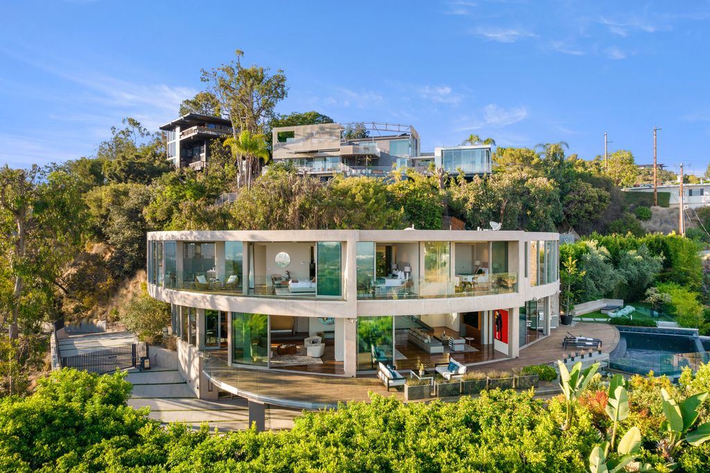 The Home in Los Angeles is an impeccably crafted three-story contemporary masterpiece with explosive, panoramic views now available for sale. This home located at 1227 N Tigertail Rd, Los Angeles, California