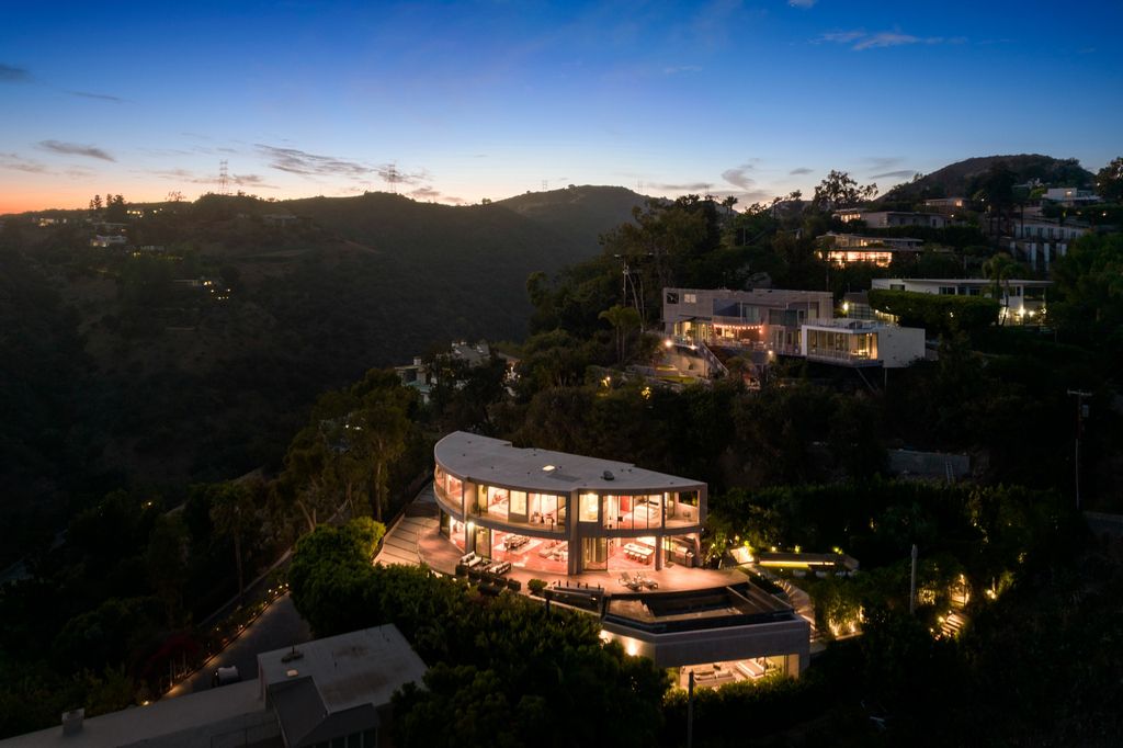 The Home in Los Angeles is an impeccably crafted three-story contemporary masterpiece with explosive, panoramic views now available for sale. This home located at 1227 N Tigertail Rd, Los Angeles, California