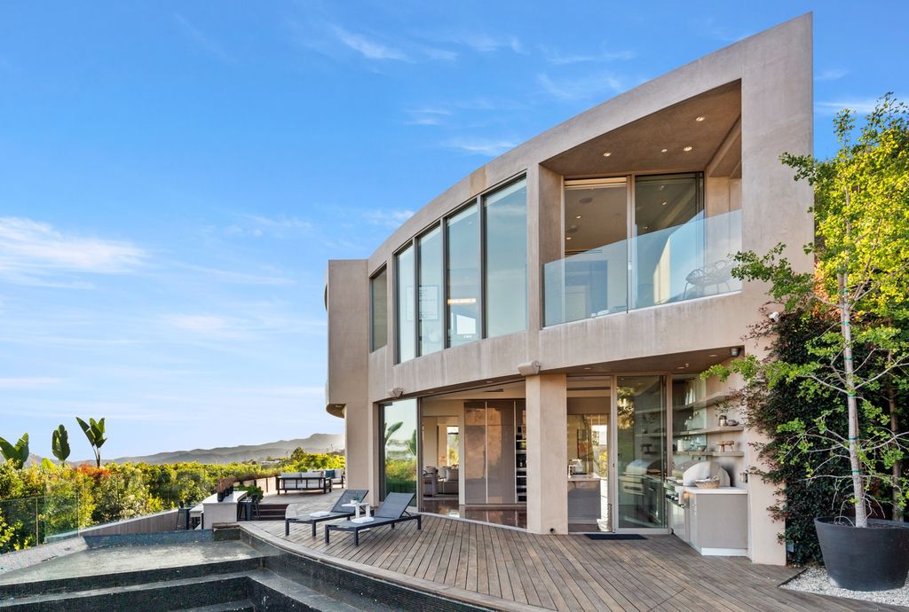 The Home in Los Angeles is an impeccably crafted three-story contemporary masterpiece with explosive, panoramic views now available for sale. This home located at 1227 N Tigertail Rd, Los Angeles, California