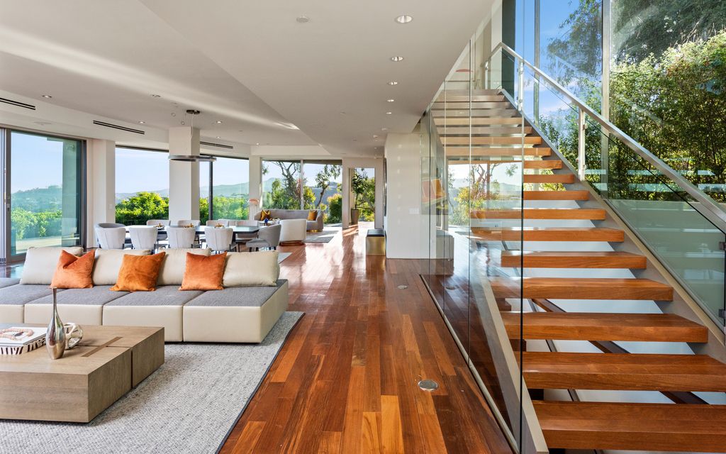 The Home in Los Angeles is an impeccably crafted three-story contemporary masterpiece with explosive, panoramic views now available for sale. This home located at 1227 N Tigertail Rd, Los Angeles, California