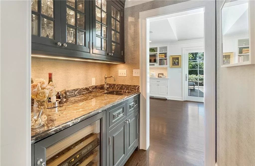 For a unique and nature-inspired kitchen design, consider green-grey cabinets. This color choice brings an earthy and organic vibe to your space. Opt for a grey shade with subtle green undertones to achieve this look. Pair the cabinets with natural materials such as butcher block countertops, bamboo flooring, or rattan pendant lights. Enhance the organic feel by incorporating indoor plants and botanical prints. The combination of green-grey cabinets and natural elements creates a soothing and refreshing transitional kitchen.