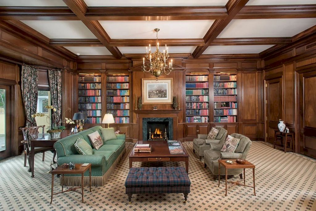 The gallery wall has become a fixture in most living rooms, and it appears that this style is here to stay. It can be as basic as hanging art or family photos on the wall, or it can be as elaborate as the built-in cabinet shown above. Favorite books span the full plane of the wall. Furthermore, the eclectic style is highlighted by the varied combination of green couch and main wood hue.