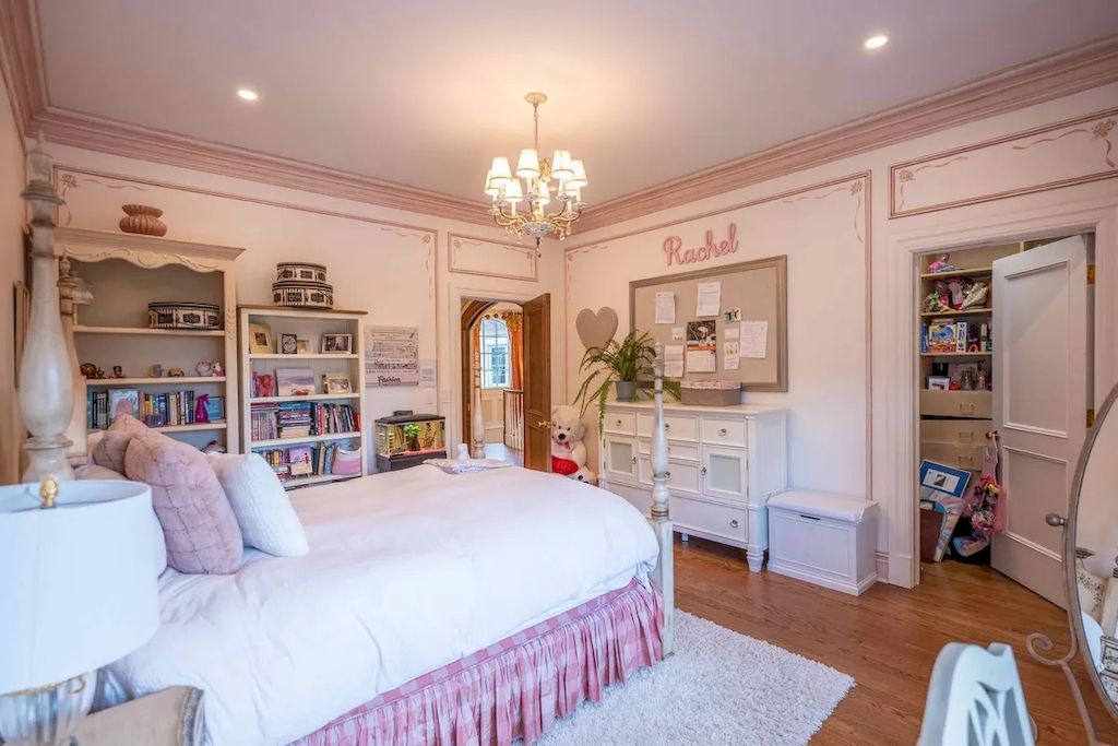 Going with one thing in this color and making it stand out is another excellent option for folks who don't want to commit to an all-pink bedroom. That something in this instance is the bed itself, complete with an upholstered headboard and pink bedding accented with golden chandeliers.