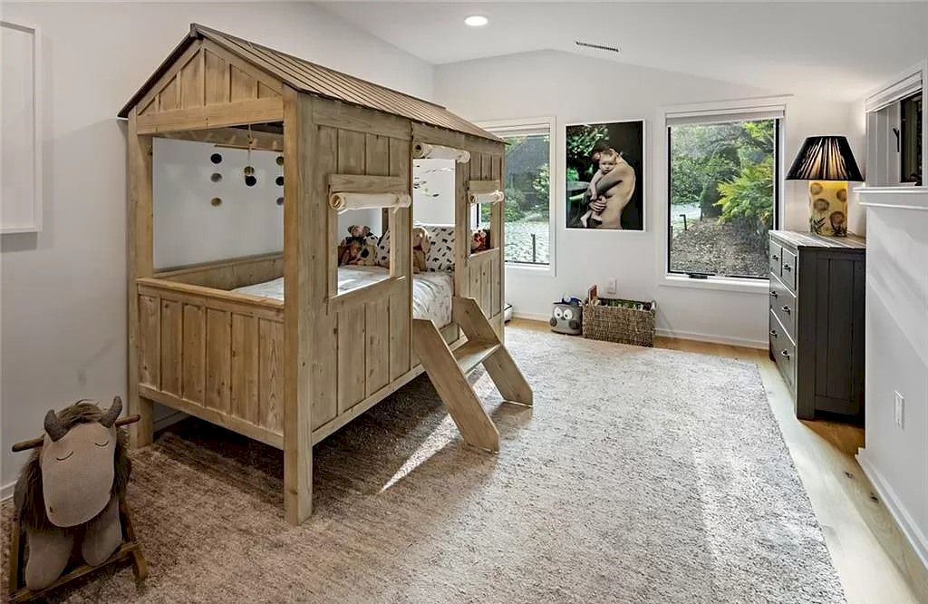 The most important thing in a child's development is fun and creativity in all matters. And nothing is better than creating a bedroom design that is the perfect combination of entertainment space and resting space. The bed is placed in a miniature tree house model with a ladder to create a real feeling. The soft gray felt rug makes the kids don't even need to wear slippers. 