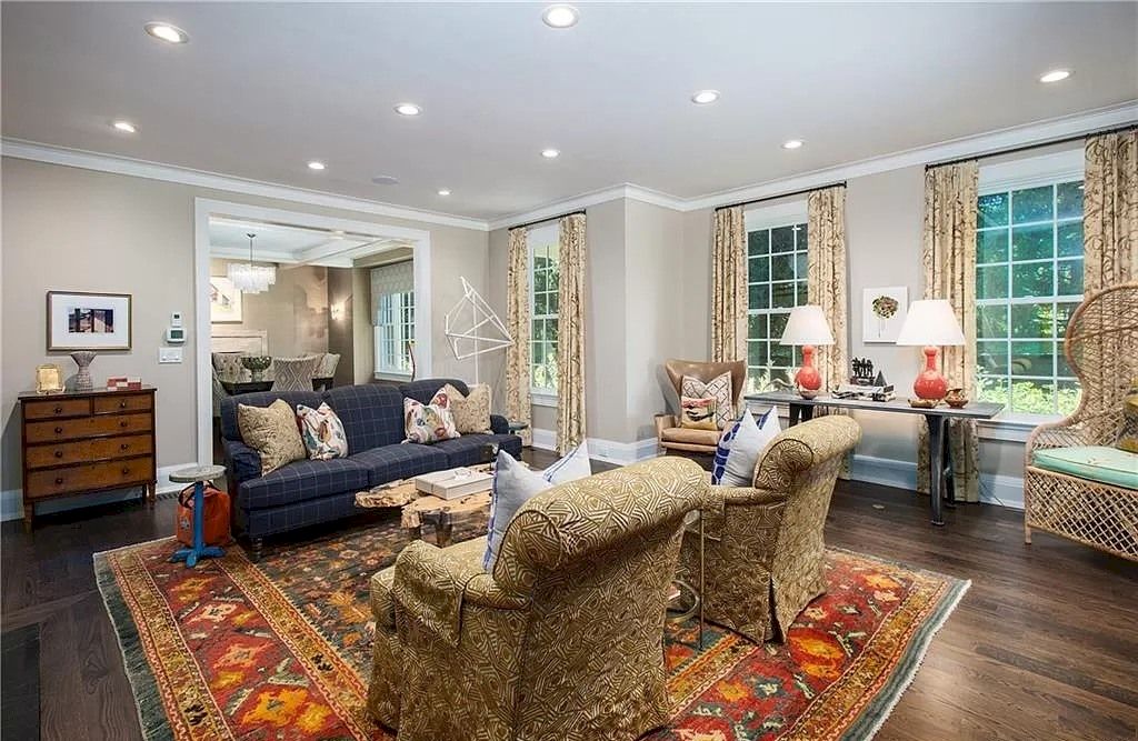 The pleasure of this peaceful village living room environment may be found in the textures, patterns, and even the corner cabinet. The look of a blue long couch in a room with a cream color scheme is a way to make a statement and stand out. The most important thing to remember is that you should choose the most harmonic option and stick with it throughout the room.