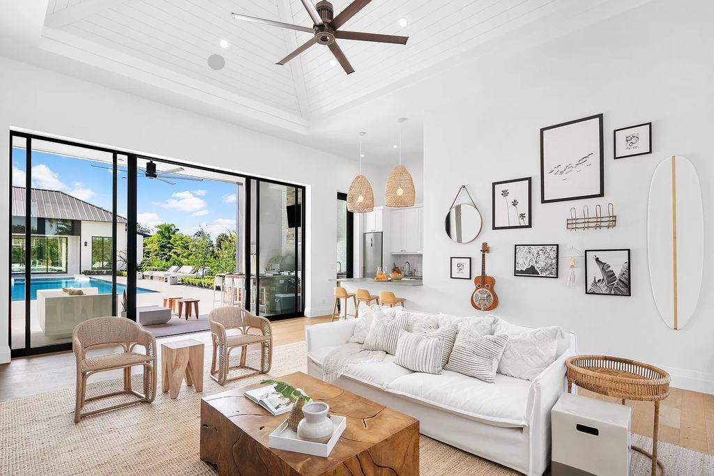 The harmony of brown in the wooden coffee table, eye-catching sofa, white paint for the wall and vault achieves the minimalist style to the pinnacle of perfection. This Living Room Idea With Colors is a prime example of this style. This color paring creates absolute visual effect, making your space more spacious and airy. 