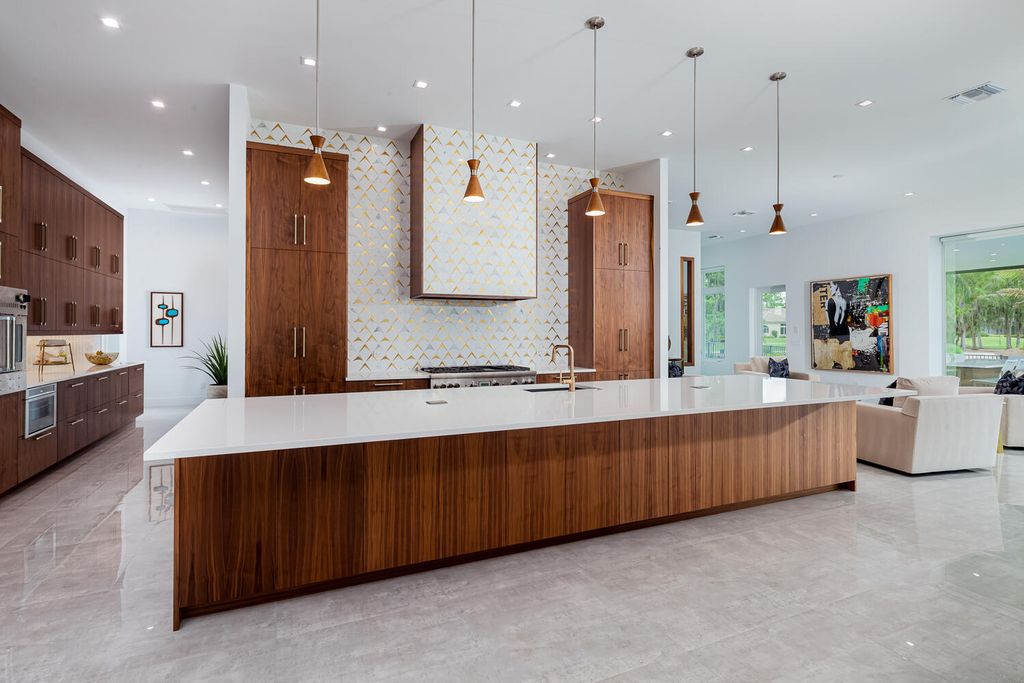 The Home in Naples is a perfect new estate expertly crafted with cutting-edge international design and mid-century modern influences now available for sale. This home located at 4445 Silver Fox Dr, Naples, Florida