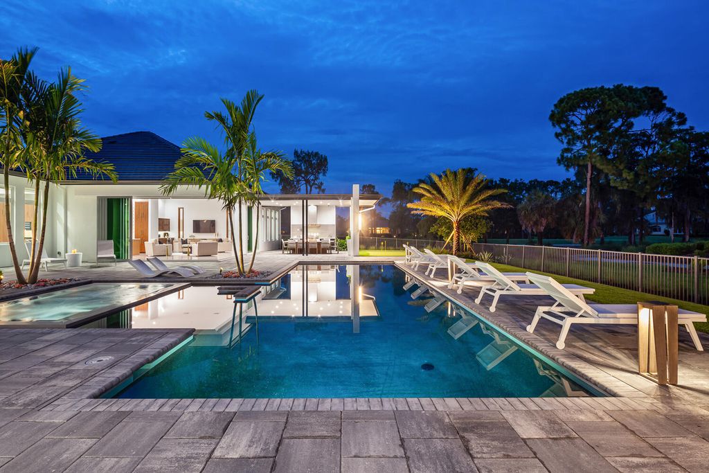 The Home in Naples is a perfect new estate expertly crafted with cutting-edge international design and mid-century modern influences now available for sale. This home located at 4445 Silver Fox Dr, Naples, Florida
