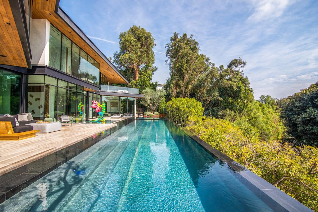 The Mansion in Bel Air is a glass-encased home designed by renowned architect Paul McClean masterfully nestled amongst lush now available for sale.