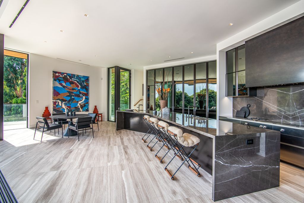 The Mansion in Bel Air is a glass-encased home designed by renowned architect Paul McClean masterfully nestled amongst lush now available for sale.