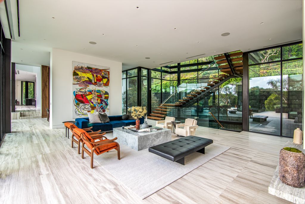 The Mansion in Bel Air is a glass-encased home designed by renowned architect Paul McClean masterfully nestled amongst lush now available for sale.