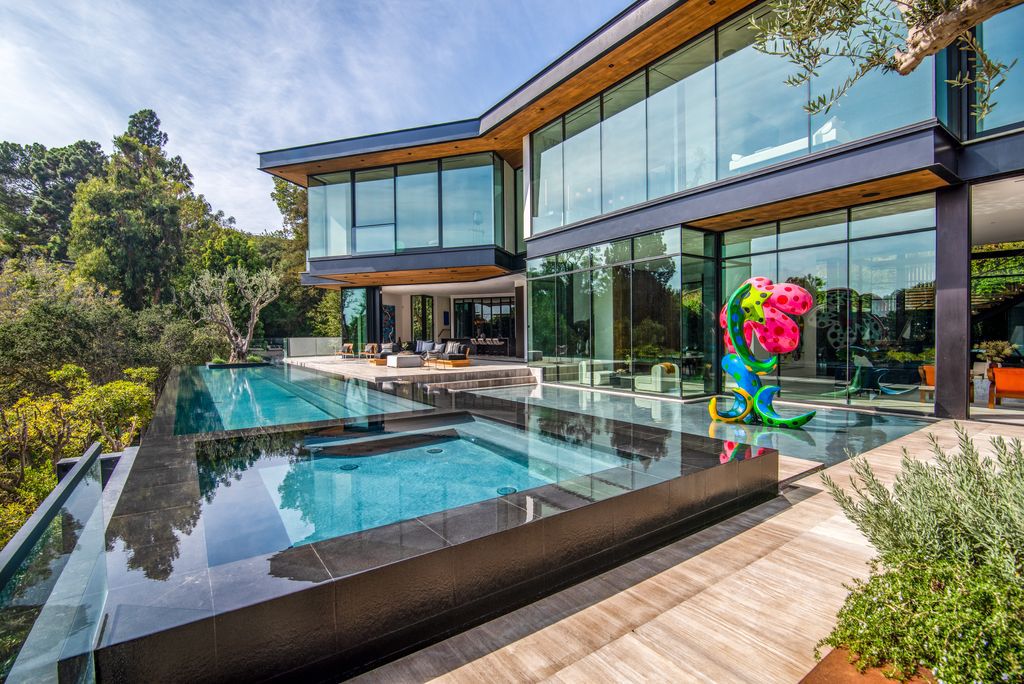 The Mansion in Bel Air is a glass-encased home designed by renowned architect Paul McClean masterfully nestled amongst lush now available for sale.