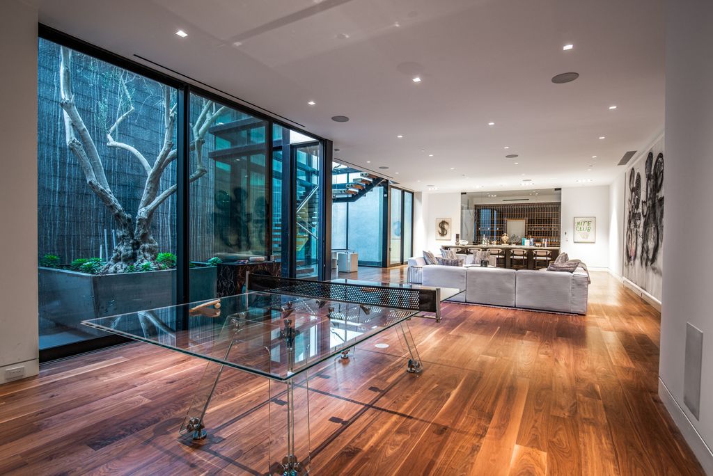 The Mansion in Bel Air is a glass-encased home designed by renowned architect Paul McClean masterfully nestled amongst lush now available for sale.