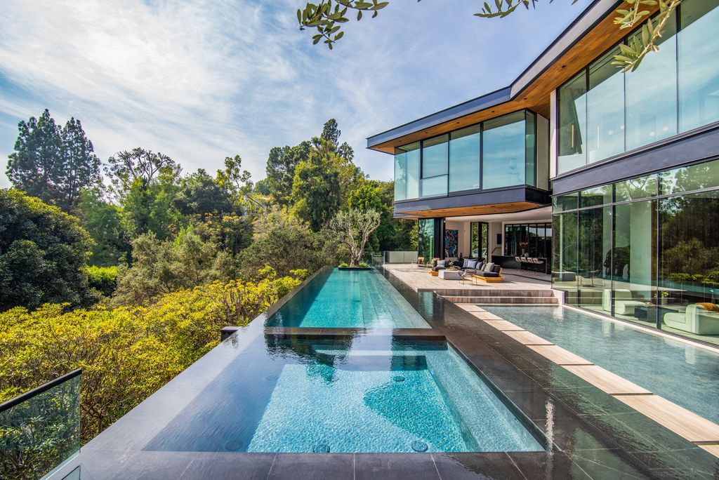 The Mansion in Bel Air is a glass-encased home designed by renowned architect Paul McClean masterfully nestled amongst lush now available for sale.