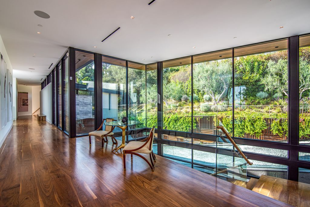 The Mansion in Bel Air is a glass-encased home designed by renowned architect Paul McClean masterfully nestled amongst lush now available for sale.