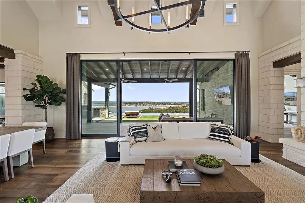 The Farmhouse in Austin is a masterfully crafted home perfectly situated to take in the breathtaking views of Lake Travis now available for sale. This home located at 613 Schickel Ter, Austin, Texas