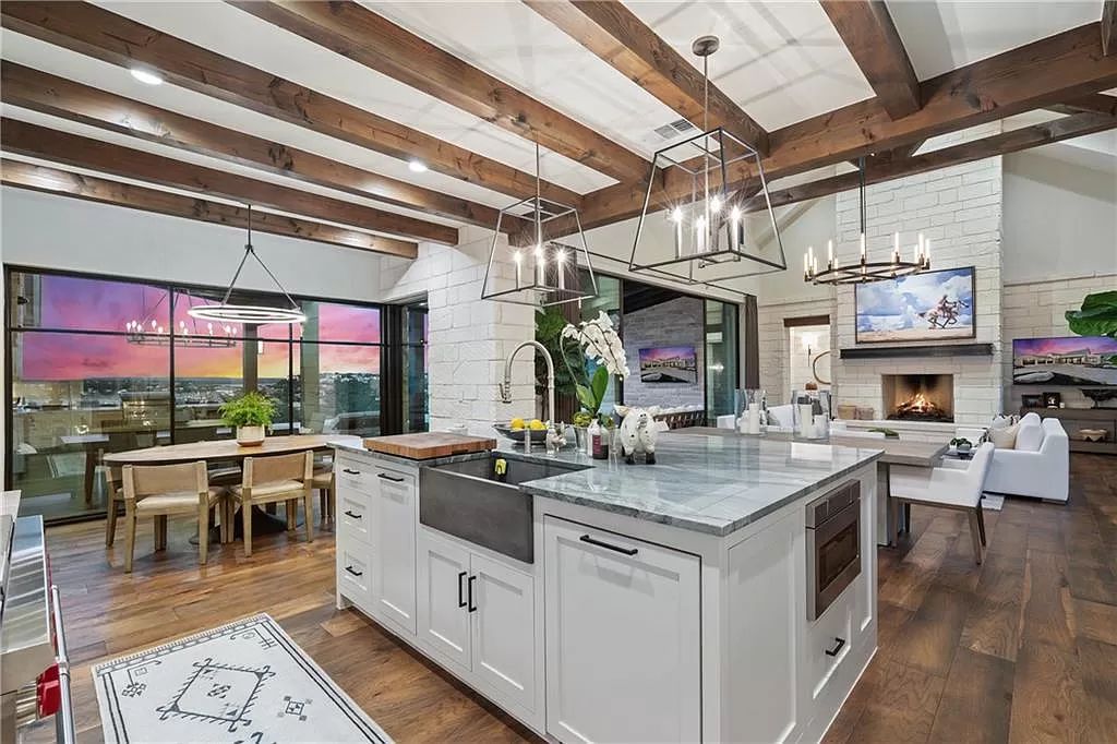 The Farmhouse in Austin is a masterfully crafted home perfectly situated to take in the breathtaking views of Lake Travis now available for sale. This home located at 613 Schickel Ter, Austin, Texas