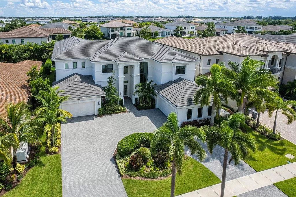 The Home in Delray Beach is a zen masterpiece on a gorgeous lakefront lot with resort style pool showcasing the pinnacle of Florida living now available for sale. This home located at 9544 Balenciaga Ct, Delray Beach, Florida