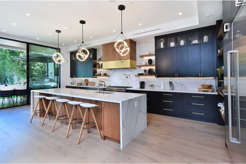 The Home in Encino is a gorgeous new construction with the warm organic natural materials have a sleek polished contemporary design now available for sale. This home located at 4544 Woodley Ave, Encino, California