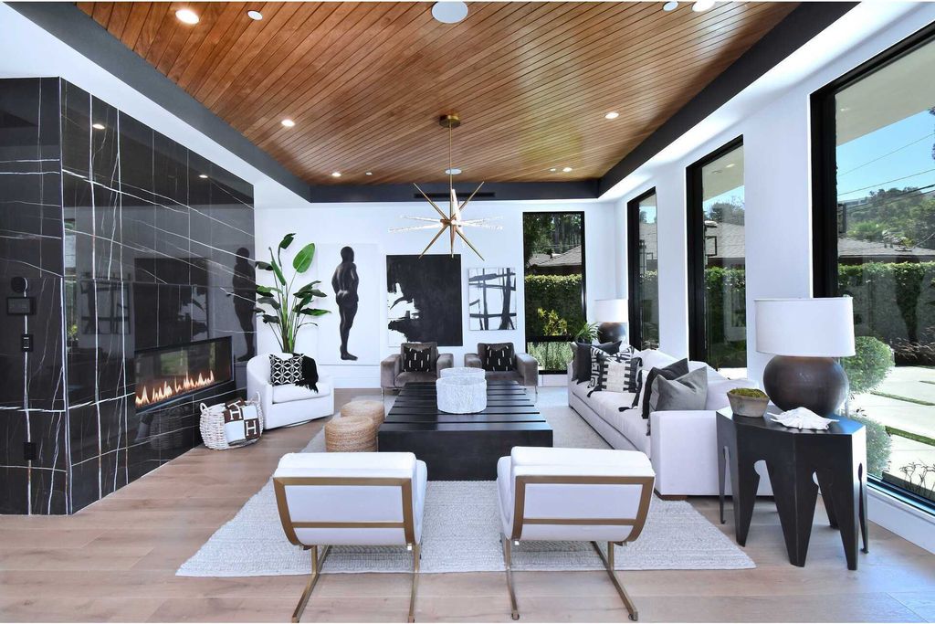 The Home in Encino is a gorgeous new construction with the warm organic natural materials have a sleek polished contemporary design now available for sale. This home located at 4544 Woodley Ave, Encino, California