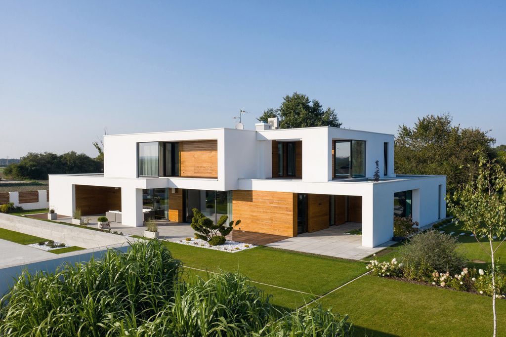 House with Niches, Combines Elegant White Blocks by RS + Robert Skitek