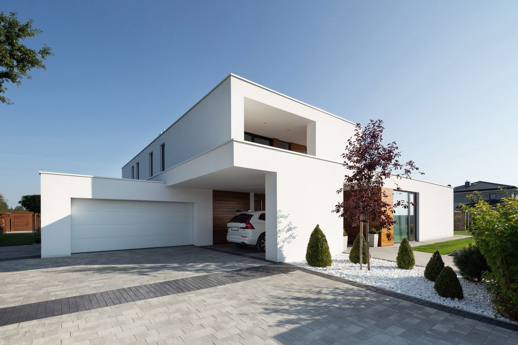 House with Niches, Combines Elegant White Blocks by RS + Robert Skitek