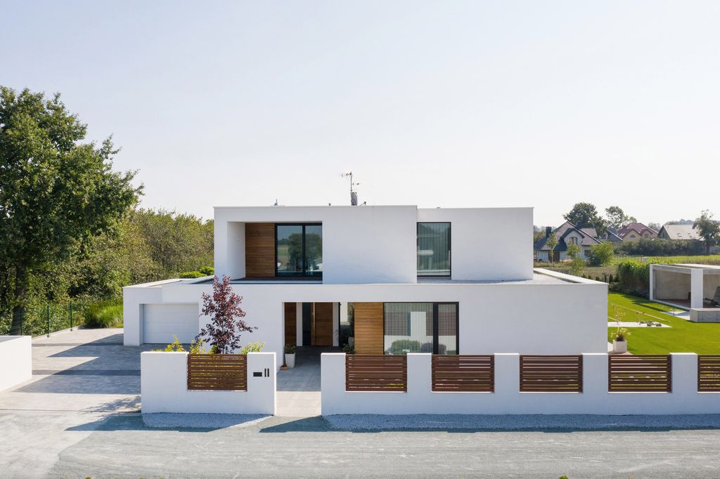 House with Niches, Combines Elegant White Blocks by RS + Robert Skitek