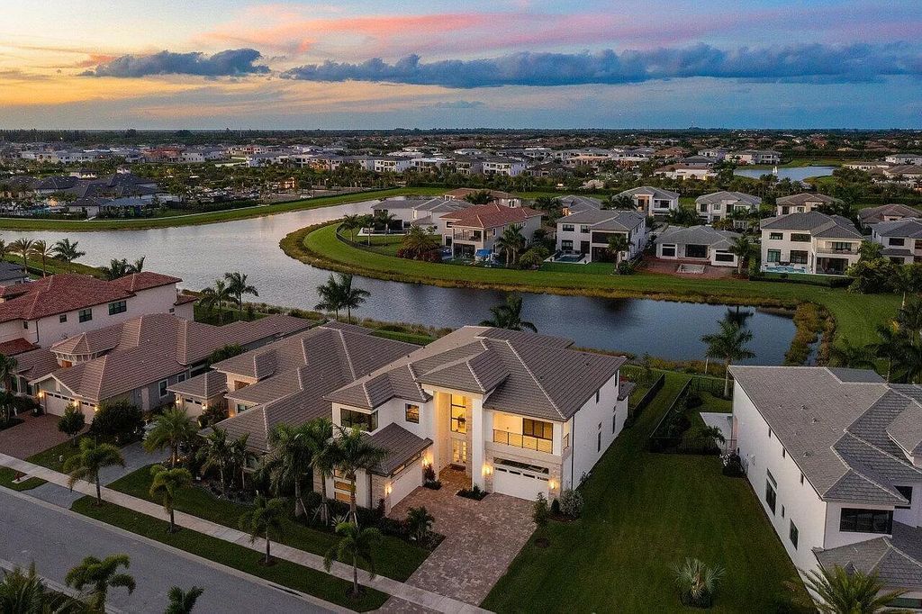 The Home in Boca Raton is a new transitional contemporary estate in the community of Boca Bridges with lake views now available for sale. This home located at 17413 Rosella Rd, Boca Raton, Florida